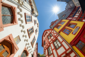 Old town Limburg an der Lahn with colorful mediaeval half timbered houses, wide angle view from down to top on a sunny day, Hesse, Germany, Europe