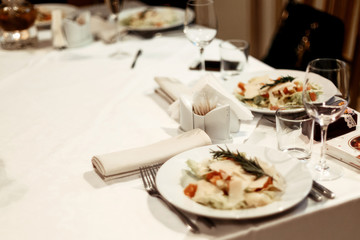 stylish luxury table with food and drinks at elegant celebration, catering in restaurant