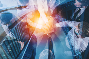 Handshaking business person in office. concept of teamwork and partnership. double exposure with...