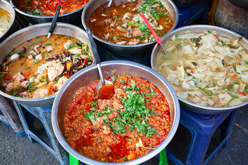 delicious fresh street food in Thailand - top view - Thai Curry, Tamarind, Tom Yam, Shrimp, Pork, Pad Thai