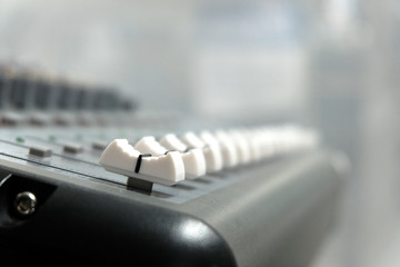 Mixing console close-up. Sound check for the concert. Mixer control. Music equipment and technology...