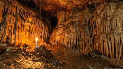 inside the cave with stalactites