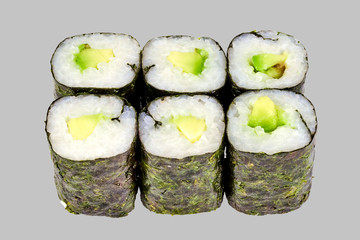sushi maki roll with avocado on a gray background