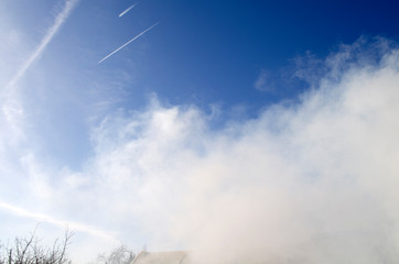 Smoke and blue sky