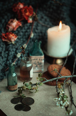 still life candle and dried flowers