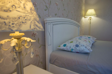 Interior with white bed and table lamp. Bedroom