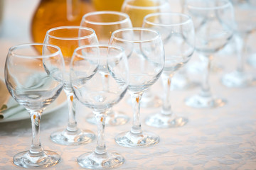 Row of glasses diagonally. Wine glasses for a buffet table