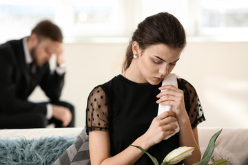 Woman pining after her relative at funeral