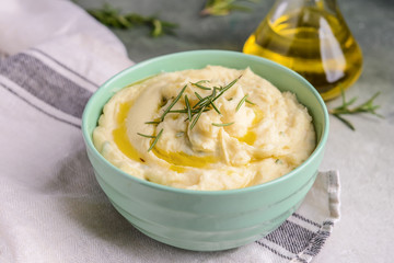 Bowl with tasty mashed potato on table