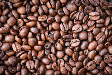 Roasted coffee beans texture background / Close up coffee bean top view