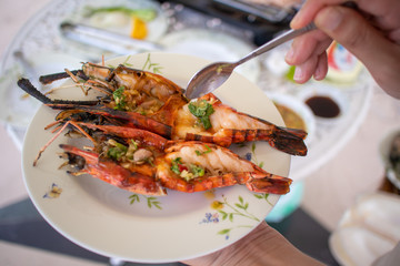 Grilled shrimps with seafood spicy sauce.