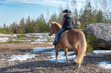 Woman horseback riding 