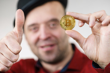 Man having bitcoin coin
