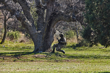 Armed soldier ready for battle. Military concept.Playing air soft.
