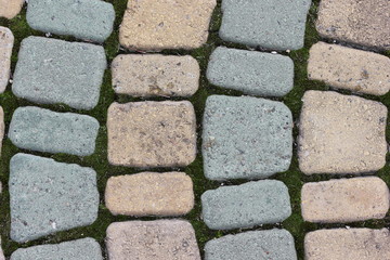 Abstract bokeh background of paved stone and lawn. garden path