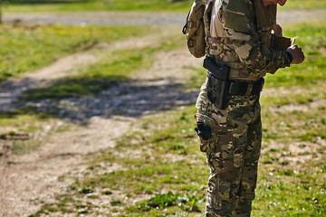 Armed soldier get ready for battle. Military concept.Playing air soft.