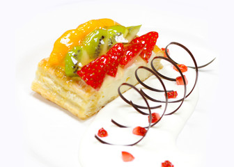 fruit cake with strawberry, kiwi, berry and peaches, raspberries, orange and other fruits