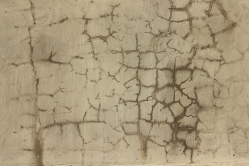 Background of vintage cracked painted brown concrete plaster