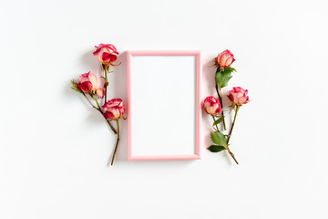 Photo frame mockup and pink roses