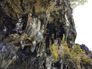 Thailand , Phuket. Stone grotto in the middle of the sea and water, tourist route