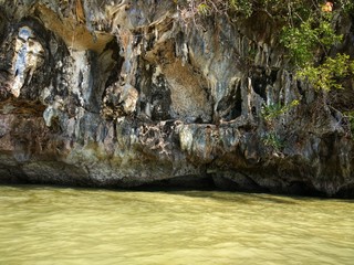Thailand , Phuket. Stone grotto in the middle of the sea and water, tourist route