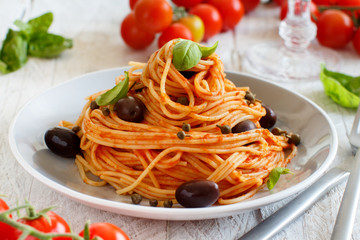 Spaghetti with tomato sauce olives and capers