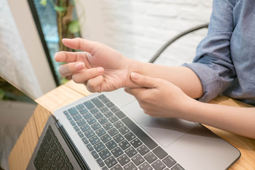 close up employee woman massage on his hand and arm for relief pain from hard working..working woman concept.