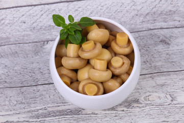 Pickled champignon heap in the bowl