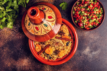 Traditional moroccan tajine of chicken with dried fruits and spices.
