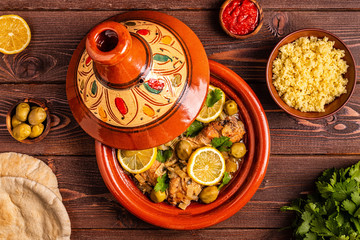 Traditional moroccan tajine of chicken with salted lemons, olives