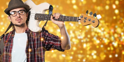 Male Guitarist playing music on background