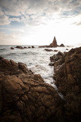 Spain, Almería, Cabo de Gata, Sirens Reef (Arrecife de las sirenas) - Long exposure on sunset, sea and rocks