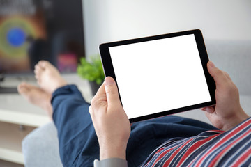 man hands holding computer tablet with isolated screen in room