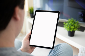 man hands holding computer tablet with isolated screen in room © DenPhoto