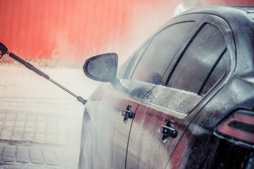 Car washing. Cleaning Car Using High Pressure Water. 