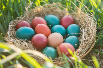 Fototapeta na wymiar basket with painted colorful easter eggs 