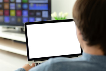 man holding laptop with isolated screen in the room