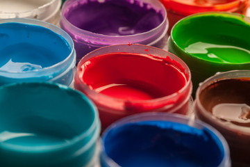Fototapeta premium Jars with different colors of acrylic paint