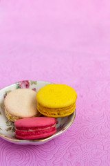 Macaroons fresh colorful close up. French dessert food background.