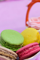 Macaroons fresh colorful close up. French dessert food background.