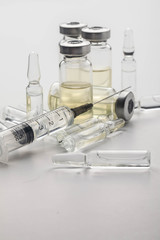 Subcutaneous syringe. Syringes with blue needles. Medical Injectors. Medical glass injection...