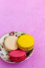 Macaroons fresh colorful close up. French dessert food background.