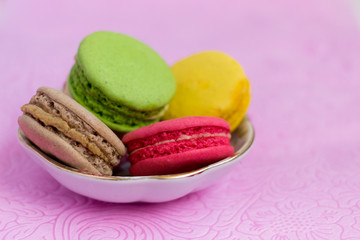 Macaroons fresh colorful close up. French dessert food background.