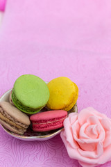Macaroons fresh colorful close up. French dessert food background.