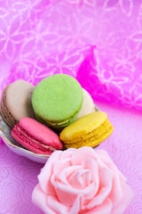 Macaroons fresh colorful close up. French dessert food background.