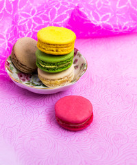 Macaroons fresh colorful close up. French dessert food background.