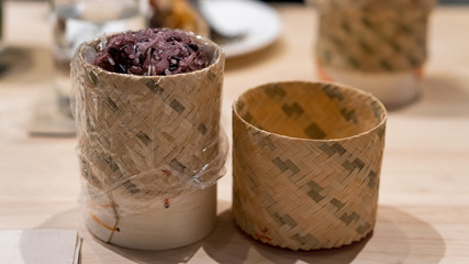 Glutinous rice in a wooden cup