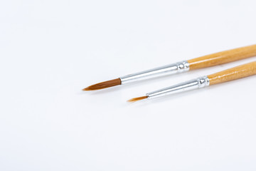 Painting brushes. Drawing tools, paint brushes on white background, copy space, top view