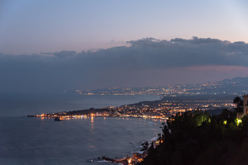 View of the Mediterranean Coast at Night from Sicily, Italy