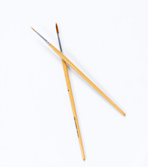 Painting brushes. Drawing tools, paint brushes on white background, copy space, top view